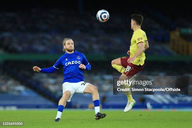 Tom Davies of Everton battles with Ashley Westwood of Burnley during the Premier League match between Everton and Burnley at Goodison Park on March...
