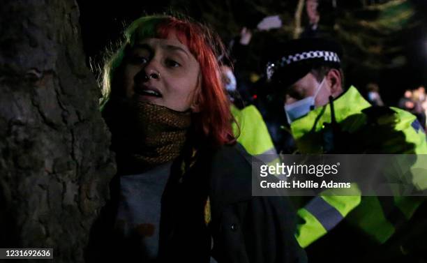 Woman is arrested during a vigil for Sarah Everard on Clapham Common on March 13, 2021 in London, United Kingdom. Vigils are being held across the...