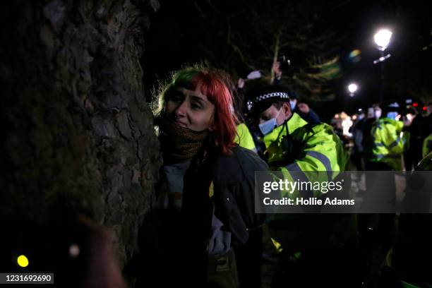 Woman is arrested during a vigil for Sarah Everard on Clapham Common on March 13, 2021 in London, United Kingdom. Vigils are being held across the...