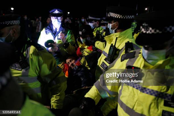 Member of public is arrested during a vigil for Sarah Everard on Clapham Common on March 13, 2021 in London, United Kingdom. Vigils are being held...