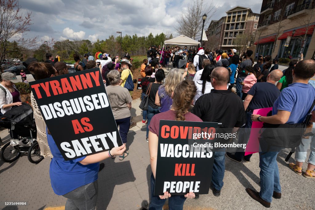 Protests Outside CDC Headquarters As Airlines Consider Vaccination Passports