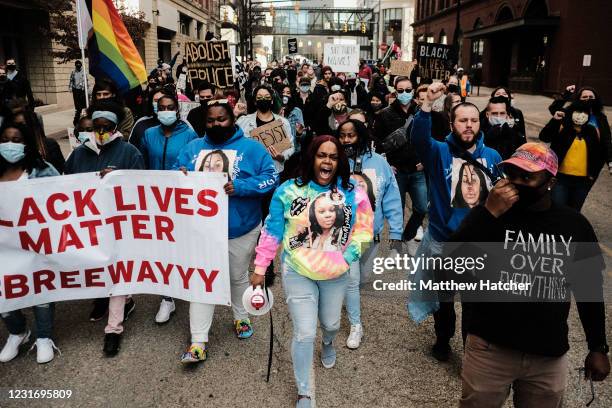 Tawanna Gordon, Breonna Taylor's cousin, leads the procession as they march through the streets in protest and remembrance of the killing of Breonna...