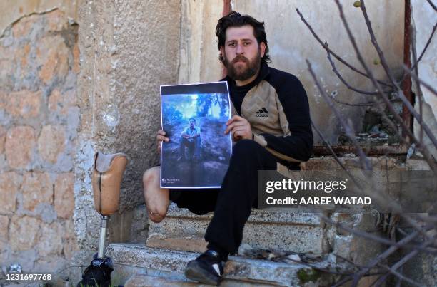 Bakri al-Debs, a 29-year-old Syrian medic and an amputee below the knee, poses for a picture in the town of Ihsim in Syria's rebel-held northwestern...