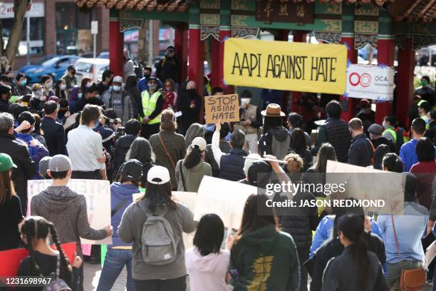 People attend the "We Are Not Silent" rally against anti-Asian hate in response to recent anti-Asian crime in the Chinatown-International District of...