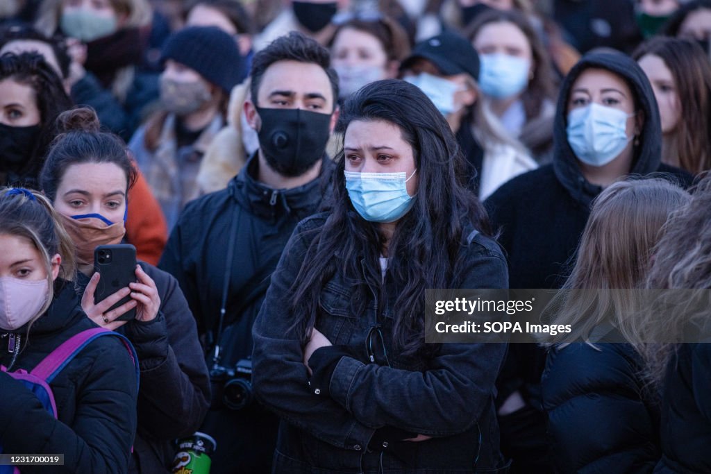A woman taking pics with her mobile phone during the vigil...