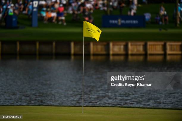Pin flag with the text Better Than Most to commemorate a putt by Tiger Woods sits on the 17th hole green during the third round of THE PLAYERS...