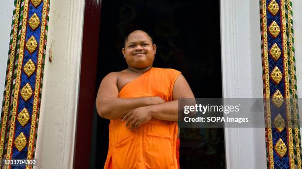 Year old Thai Buddhist monk Siriphanthito from Suphan Buri province in Thailand poses for a photo. He has been a monk since he was 13 years old,...