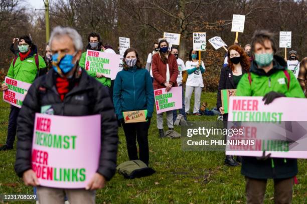 Members of The Climate Crisis Coalition, a partnership of various environmental organizations, gather during a 'Climate Alert' rally in the run-up to...