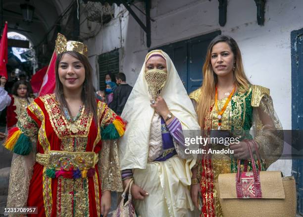 Women wearing traditional clothing take part in a march during the National Day of Traditional Dress" organized by Tunisia Heritage Association in...