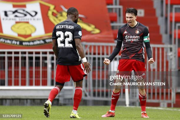 Feyenoord's Dutch defender Lutsharel Geertruida and team mate Dutch forward Steven Berghuis celebrate their 0-1 during the Dutch Eredivisie match...