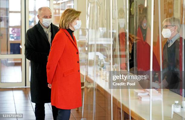 Prime Minister of Rhineland-Palatinate Malu Dreyer arrives to vote with her husband Klaus Jensen during the coronavirus pandemic on March 14, 2021 in...