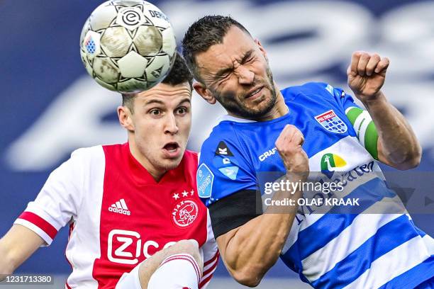 Ajax's Dutch-Moroccan midfielder Oussama Idrissi fights for the ball against PEC Zwolle's dutch defender Bram van Polen during the Dutch Eredivisie...