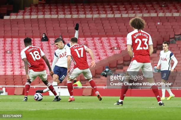 Erik Lamela of Spurs scores the opening goal with a rabona during the Premier League match between Arsenal and Tottenham Hotspur at Emirates Stadium...