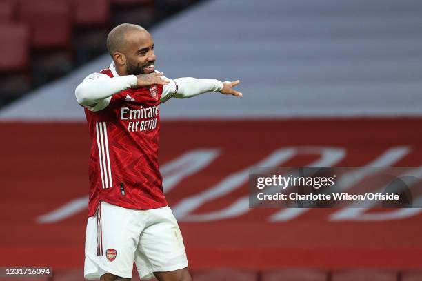 Alexandre Lacazette of Arsenal celebrates scoring their 2nd goal from the penalty spot during the Premier League match between Arsenal and Tottenham...