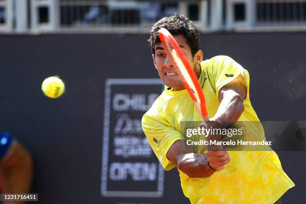 Cristian Garin of Chile plays a backhand against Facundo Bagnis of Argentina during the final of Chile Dove Men+Care Open at Club Deportivo...