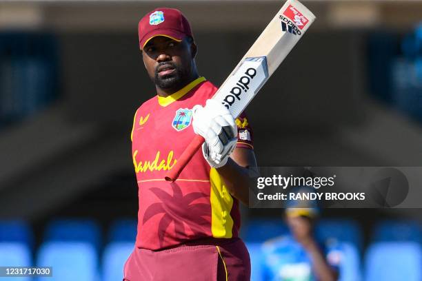 Darren Bravo of West Indies celebrates his half century during the 3rd and final ODI match between West Indies and Sri Lanka at Vivian Richards...