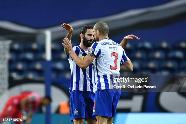 Sergio Oliveira of FC Porto celebrates with Pepe after scores his sides second goal during the Liga NOS match between FC Porto and FC Pacos de...
