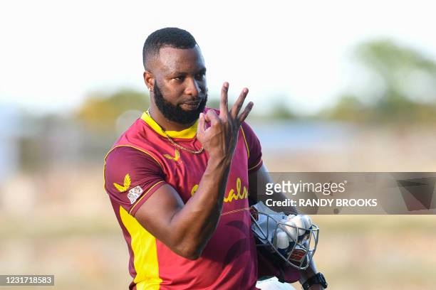 Kieron Pollard of West Indies signals taking the series 3-0 after winning the 3rd and final ODI match between West Indies and Sri Lanka at Vivian...
