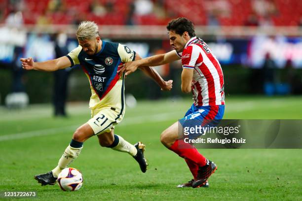 Antonio Briseño of Chivas fights for the ball with Henry Martín of America during the 11th round match between Chivas and America as part of the...
