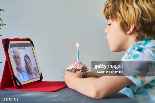 child making a video call with family - zoom birthday stock pictures, royalty-free photos & images