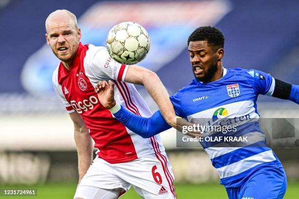 Ajax's Dutch midfielder Davy Klaassen fights for the ball against PEC Zwolle's Dutch defender Kenneth Paal during the Dutch Eredivisie match between...