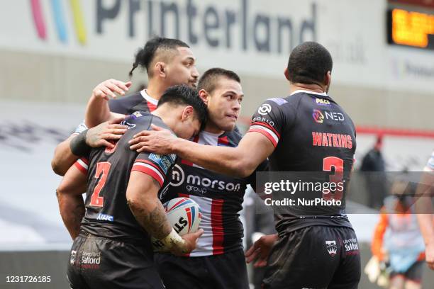 Ken Sio of Salford Red Devils scores his team's second try during the pre-season match between Salford Red Devils and Wigan Warriors at AJ Bell...