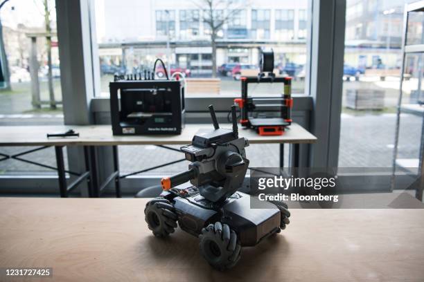 RoboMaster S1 educational robot near 3D printing machines in '42 wolfsburg', the Volkswagen AG sponsored coding school, in Wolfsburg, Germany, on...