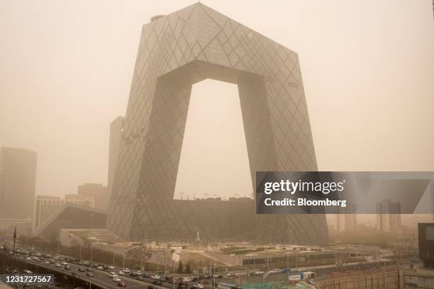 The China Central Television Tower shrouded in polluted air in Beijing, China, on Monday, March 15, 2021. A sandstorm sweeping across much of...