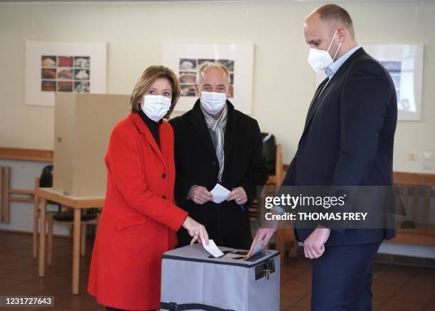 Malu Dreyer , State Premier of the western federal state of Rhineland-Palatinate, and her husband Klaus Jensen cast their ballots for state elections...