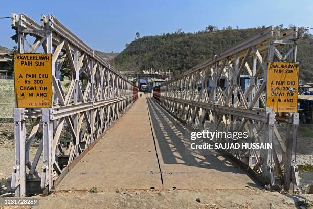 Truck is seen parked on the Myanmar's side of the bridge built over river Tiau, a natural border between India and Myanmar at Zokhawthar in India's...