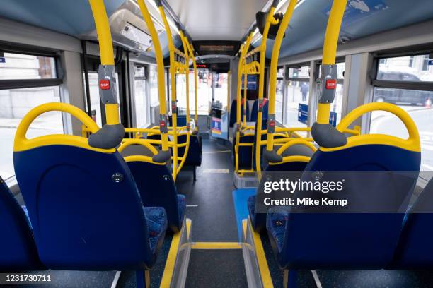 Empty bus as the national coronavirus lockdown three continues on 5th March 2021 in London, United Kingdom. Public transport use is still low amongst...