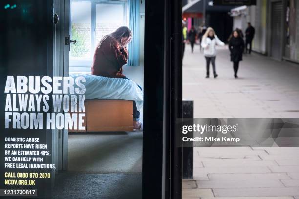 Bus stop advertisement for the National Centre for Domestic Violence or NCDV as the national coronavirus lockdown three continues on 4th March 2021...