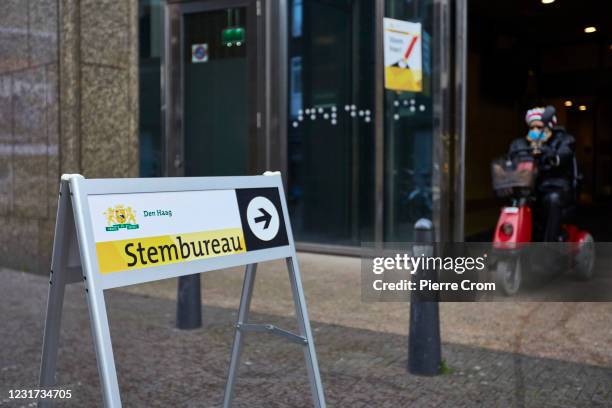 Voter leaves a polling place located in the parliament during the parliamentary elections on March 15, 2021 in The Hague, Netherlands. The...