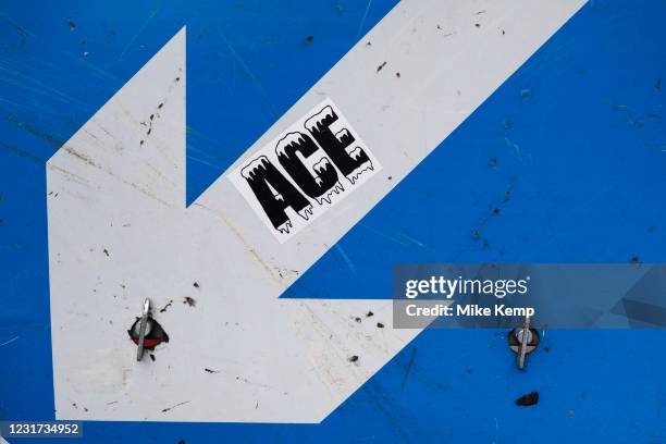 Ace sticker on a white arrow road sign on a blue background on 3rd March 2021 in London, England, United Kingdom.