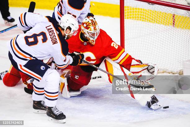Adam Larsson of the Edmonton Oilers scores against goaltender Jacob Markstrom of the Calgary Flames during the second period an NHL game at...