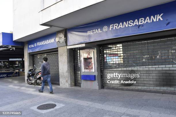 General view of a damaged bank on one of the busiest streets Hamra as the latest economic fallout comes amid a continued failure to form a new...