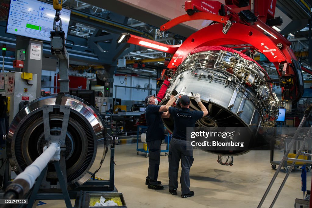 Leap Module Workers adjust components on the fan module of a LEAP-1A engine for ...