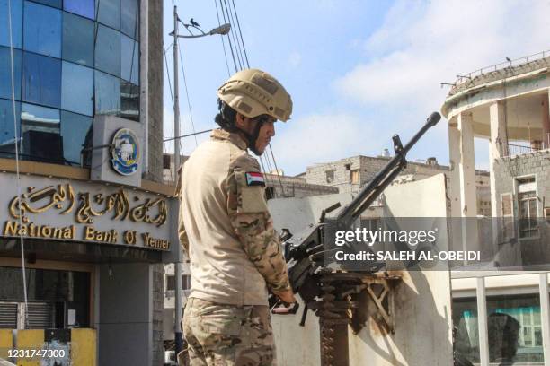 Soldier bearing insignia showing the old flag of South Yemen used by Yemen's southern separatists mans a turret while on guard during a demonstration...