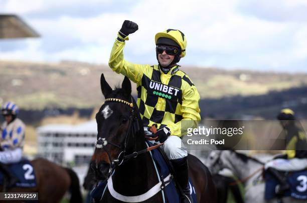 Shishkin ridden by Nico de Boinville celebrate winning the Sporting Life Arkle Challenge Trophy Novices' Chase during day one of the Cheltenham...
