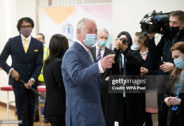 Prince Charles, Prince of Wales wears a face mask as he visits a vaccination pop-up centre at Finsbury Park Mosque on March 16, 2021 in London,...