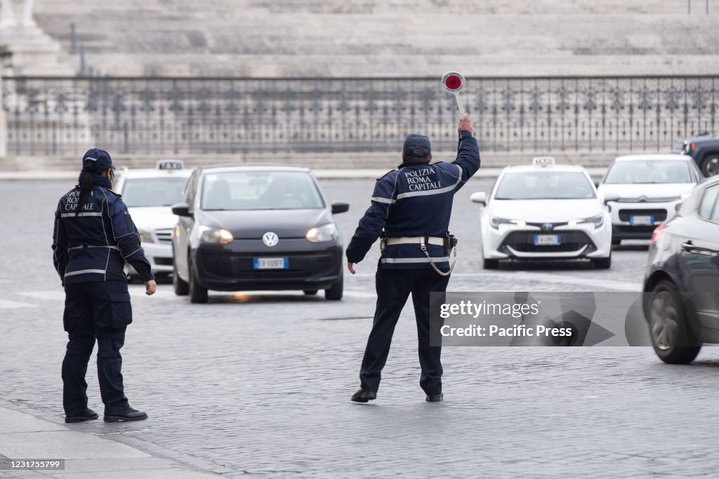 Traffic Police check the cars passing through Venice Square...