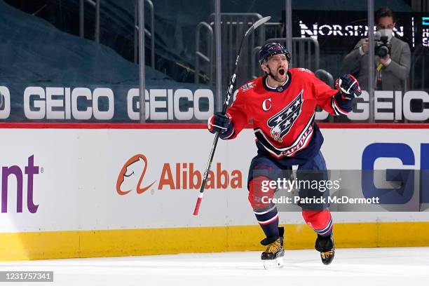 Alex Ovechkin of the Washington Capitals celebrates after scoring his 718th career NHL goal in the second period against the New York Islanders at...