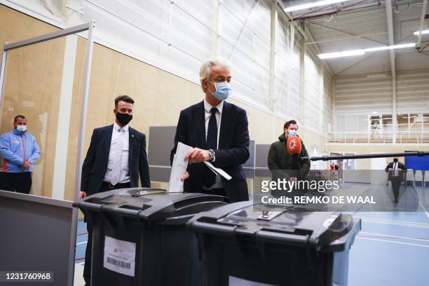 Party leader Geert Wilders casts his vote in the 2021 Dutch general elections in the Hague on March 17, 2021. - Polling stations opened on the last...