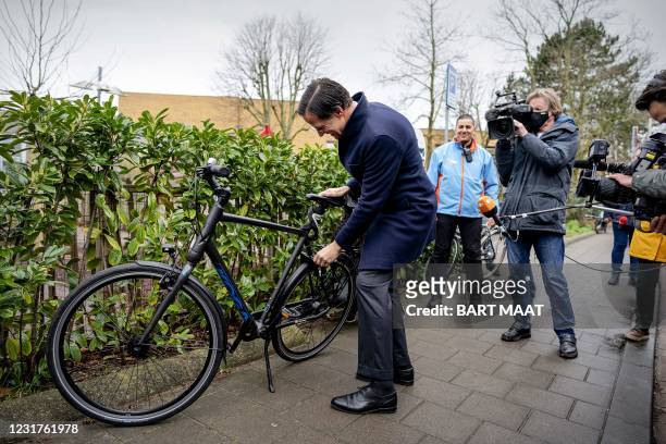 Dutch VVD's incumbent Prime Minister Mark Rutte arrives to cast his vote in the 2021 Dutch general elections in the Hague on March 17, 2021. -...