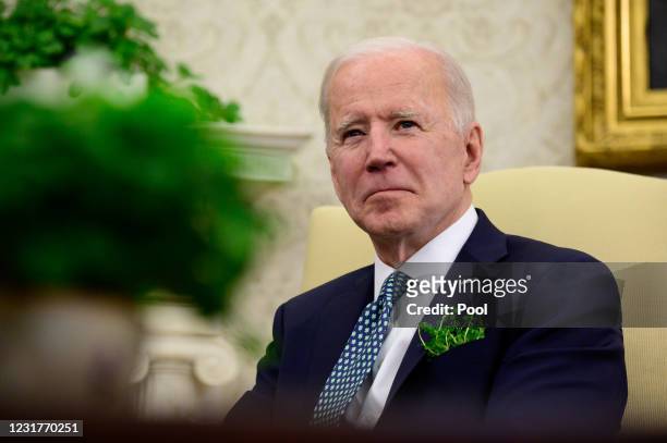 President Joe Biden listens during a virtual meeting with Irish Prime Minister Micheal Martin in the Oval Office of the White House on March 17, 2021...