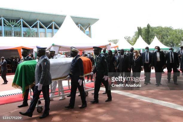 President of Ivory Coast Alassane Ouattara and his wife Dominique Folloroux-Ouattara attend an official ceremony held at Presidential Palace for...