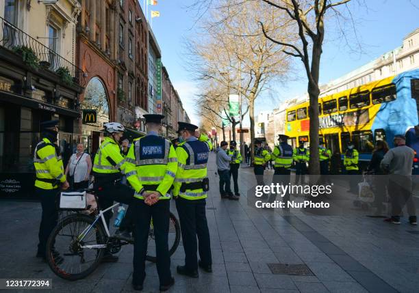 Very strong Garda presence on St. Patrick's Day on O'Connell Street in Dublin city center as all public events related to St. Patrick's Day have been...