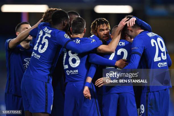 Chelsea's Moroccan midfielder Hakim Ziyech celebrates with teammates after scoring his team's first goal during the UEFA Champions League round of 16...