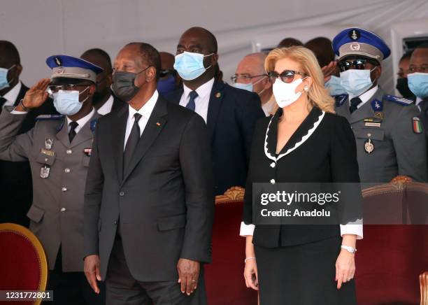 President of Ivory Coast Alassane Ouattara and his wife Dominique Folloroux-Ouattara attend an official ceremony held at Presidential Palace for...