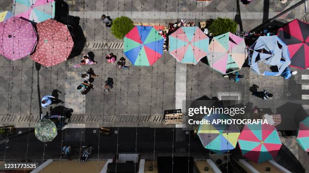 Aerial view of a street market on March 17, 2021 in San Salvador, El Salvador. El Salvador has already confirmed 62,000 positive cases of COVID-19...